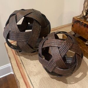 2 woven leather looking decorative spheres